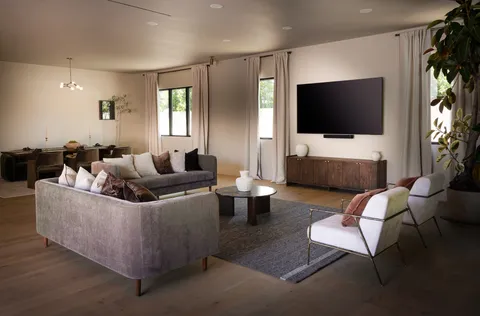 a bathroom with a double vanity sink mirror and toilet