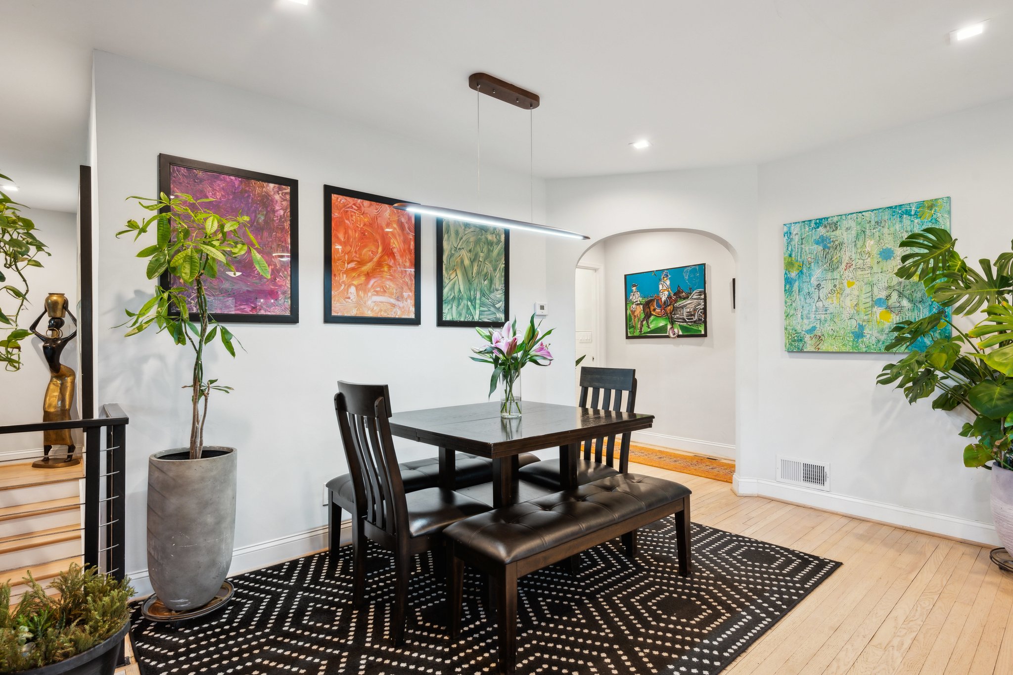 2607 Ross Road Chevy Chase, MD 20815 - Photo 11 of 37 a dining room with furniture potted plants and wooden floor