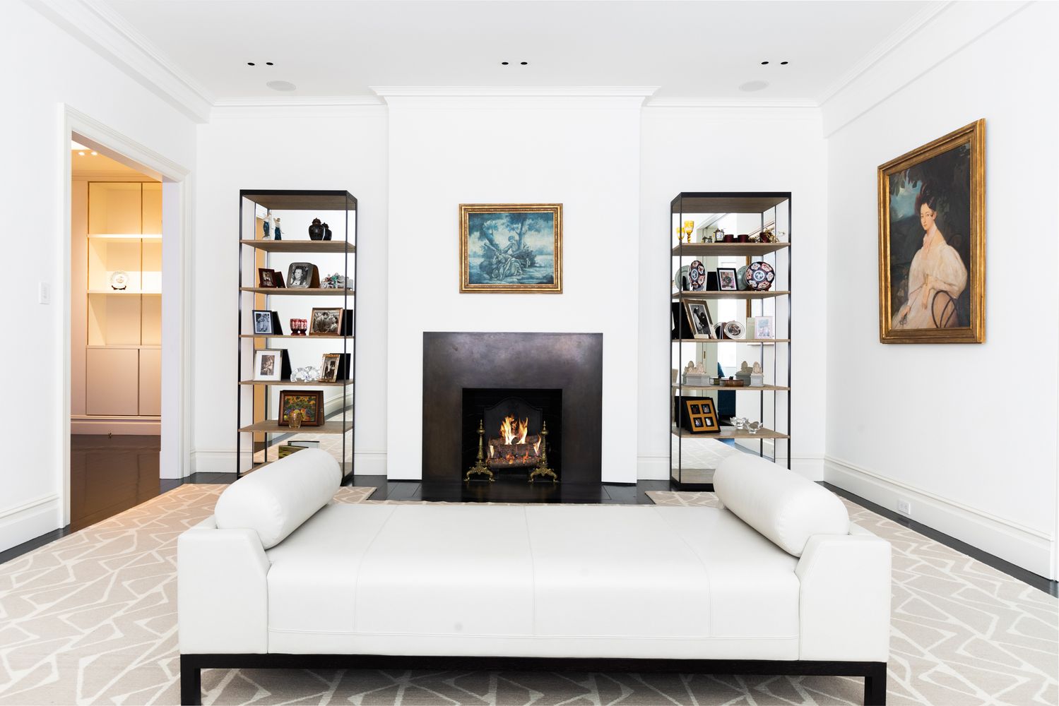 876 Park Avenue, Unit 7N Manhattan, NY 10075 - Photo 2 of 21 a living room with furniture and a fireplace