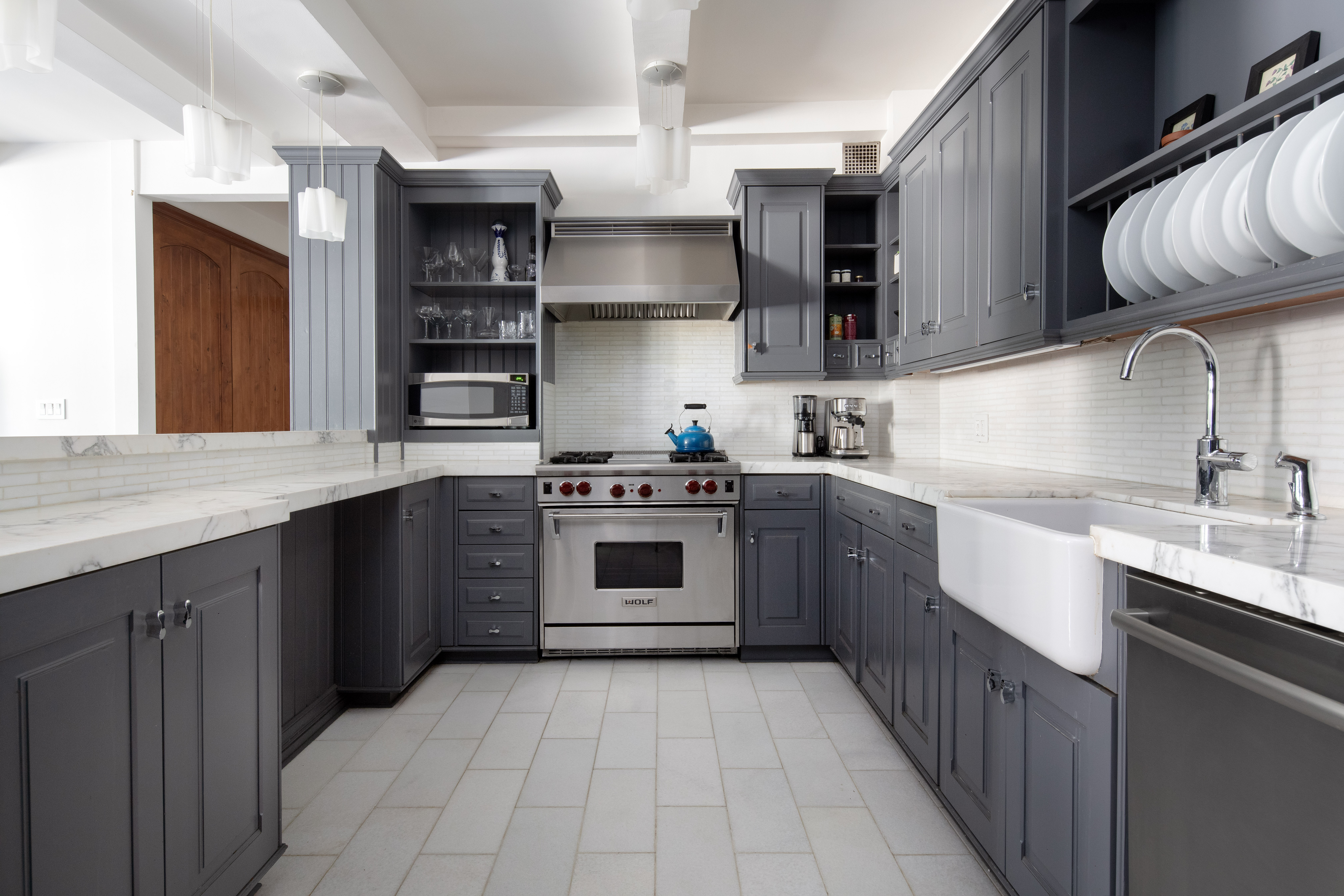 60 West 68th Street, Unit 5B Manhattan, NY 10023 - Photo 3 of 7 a kitchen with stainless steel appliances granite countertop a sink and cabinets