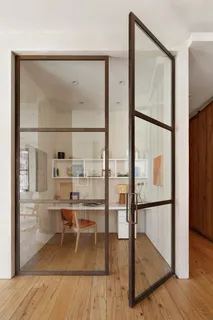 a bedroom with a bed and chair