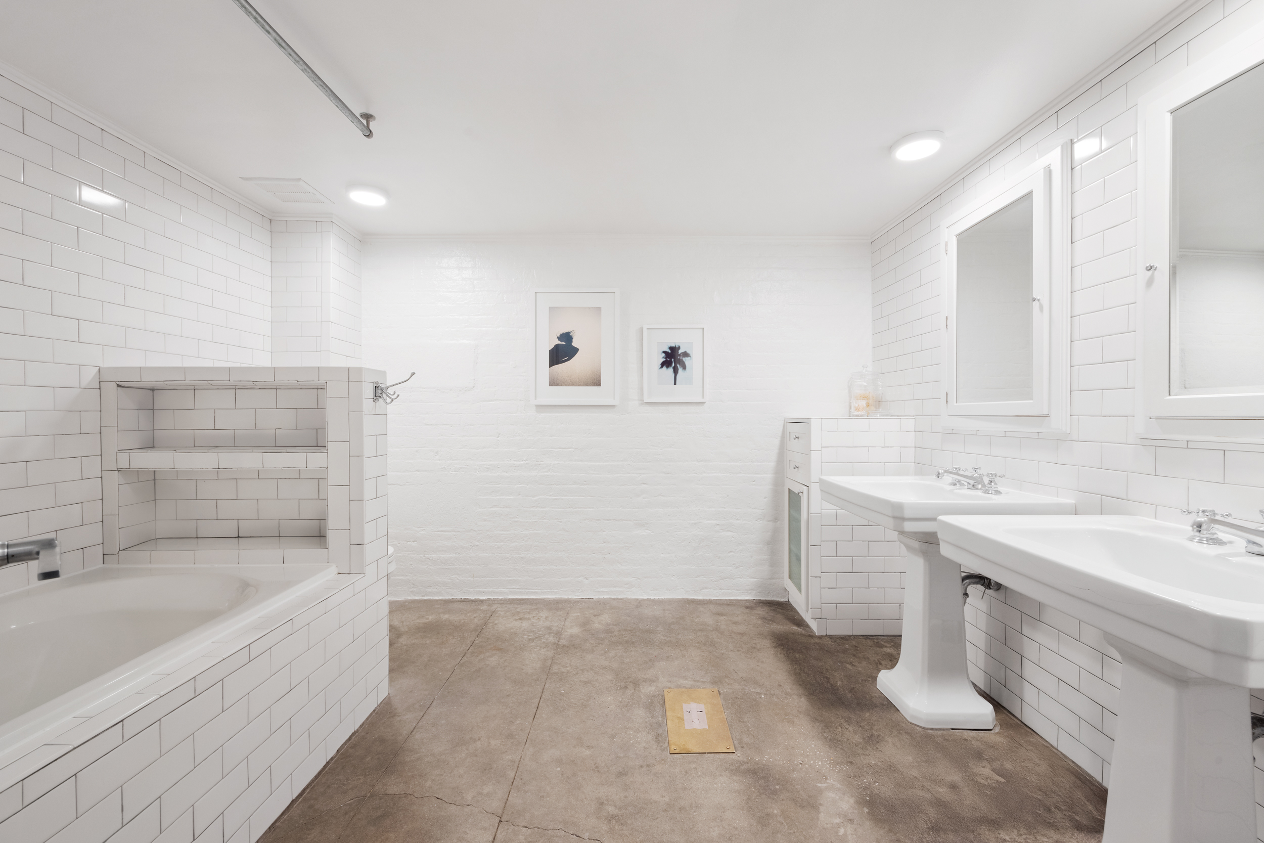125 Watts Street, Unit 1 Manhattan, NY 10013 - Photo 18 of 24 a bathroom with a sink and a bathtub