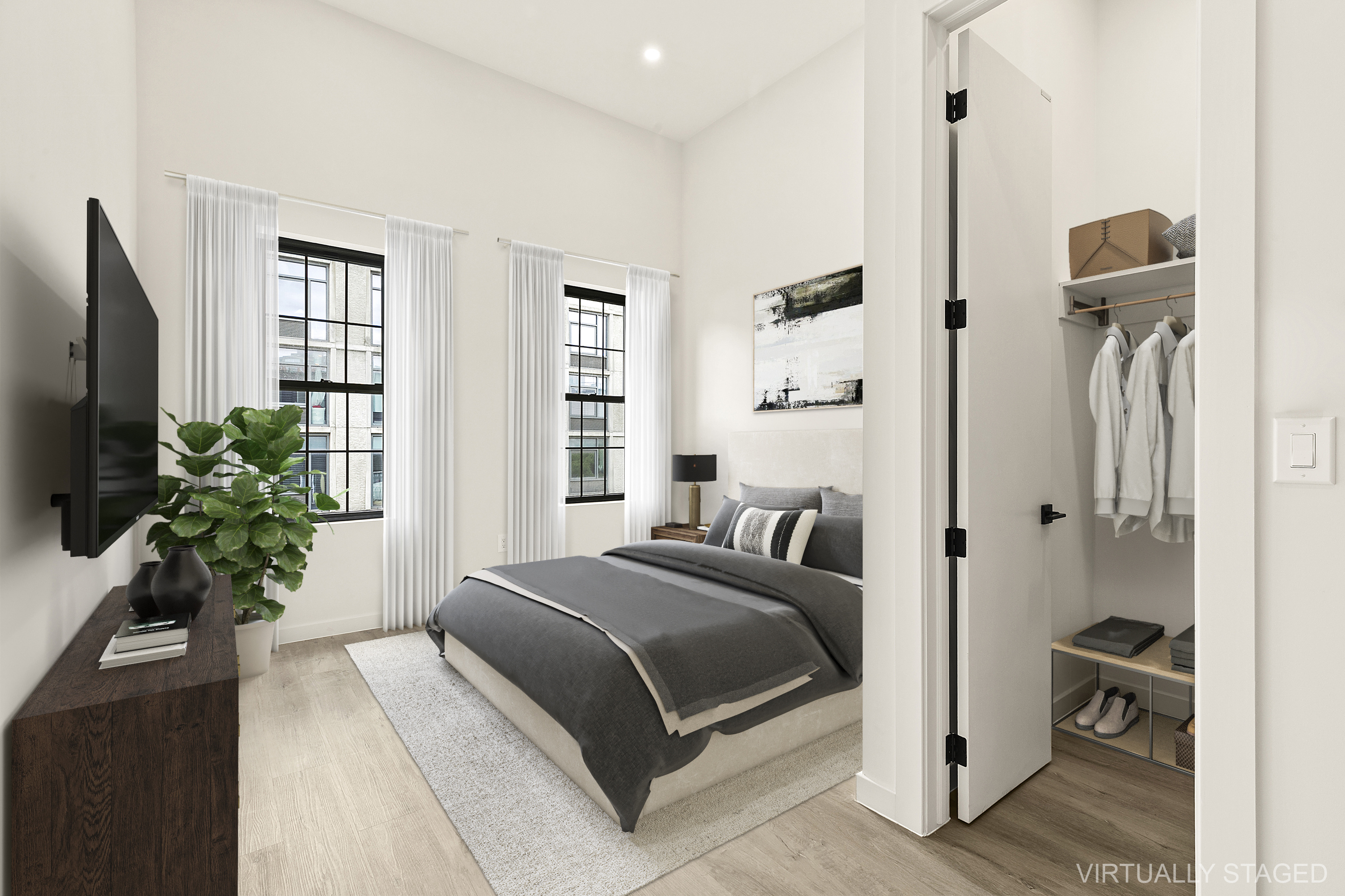 251-253 North 8th Street Brooklyn, NY 11211 - Photo 11 of 11 a bedroom with a bed and a potted plant