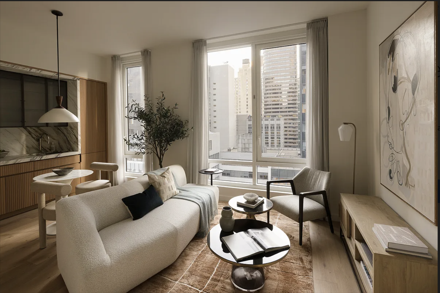 135 East 47th Street, Unit 12C Manhattan, NY 10017 - Photo 2 of 15 a living room with furniture and a large window