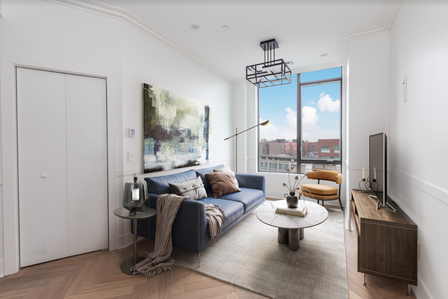 47-16 Greenpoint Avenue, Unit 3A Queens, NY 11104 - Photo 2 of 9 a living room with patio furniture and a flat screen tv