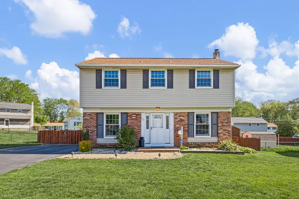 front view of a house with a yard