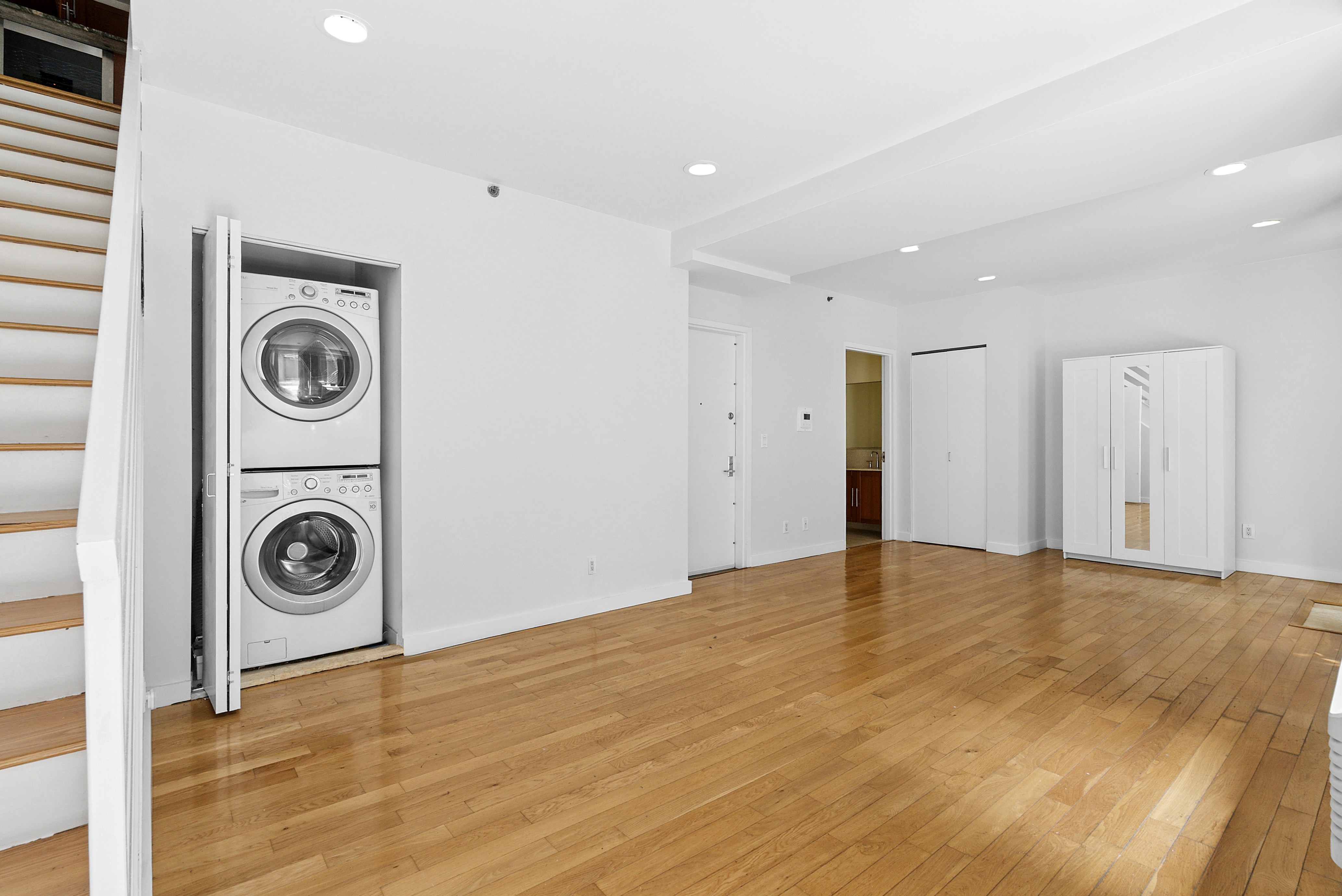 450 East 117th Street, Unit 1A Manhattan, NY 10035 - Photo 7 of 10 a view of a storage & utility room with washer and dryer