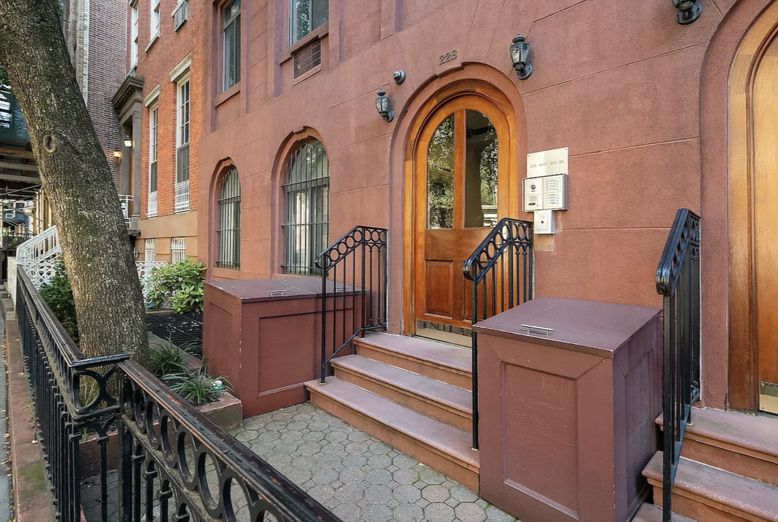 228 West 21st Street, Unit 2 Manhattan, NY 10011 - Photo 12 of 14 a view of a house with many windows