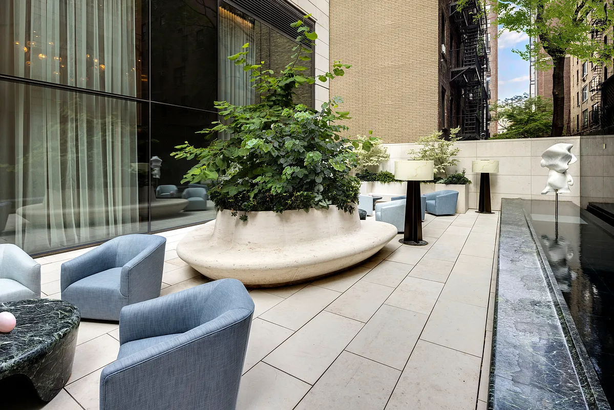 430 East 58th Street, Unit 38A Manhattan, NY 10022 - Photo 11 of 22 a view of a patio with couches and potted plants