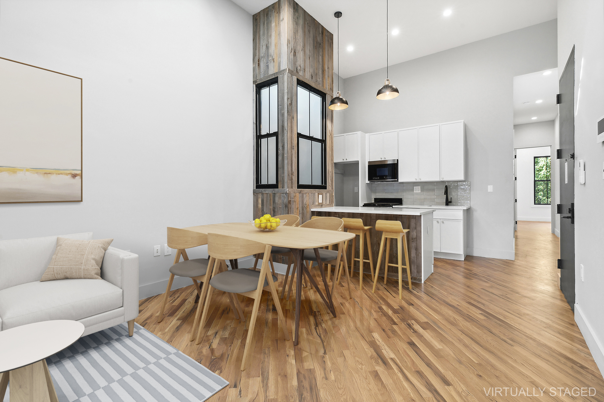 866 Bushwick Avenue, Unit 2 Brooklyn, NY 11221 - Photo 2 of 12 a view of a dining room with furniture and wooden floor