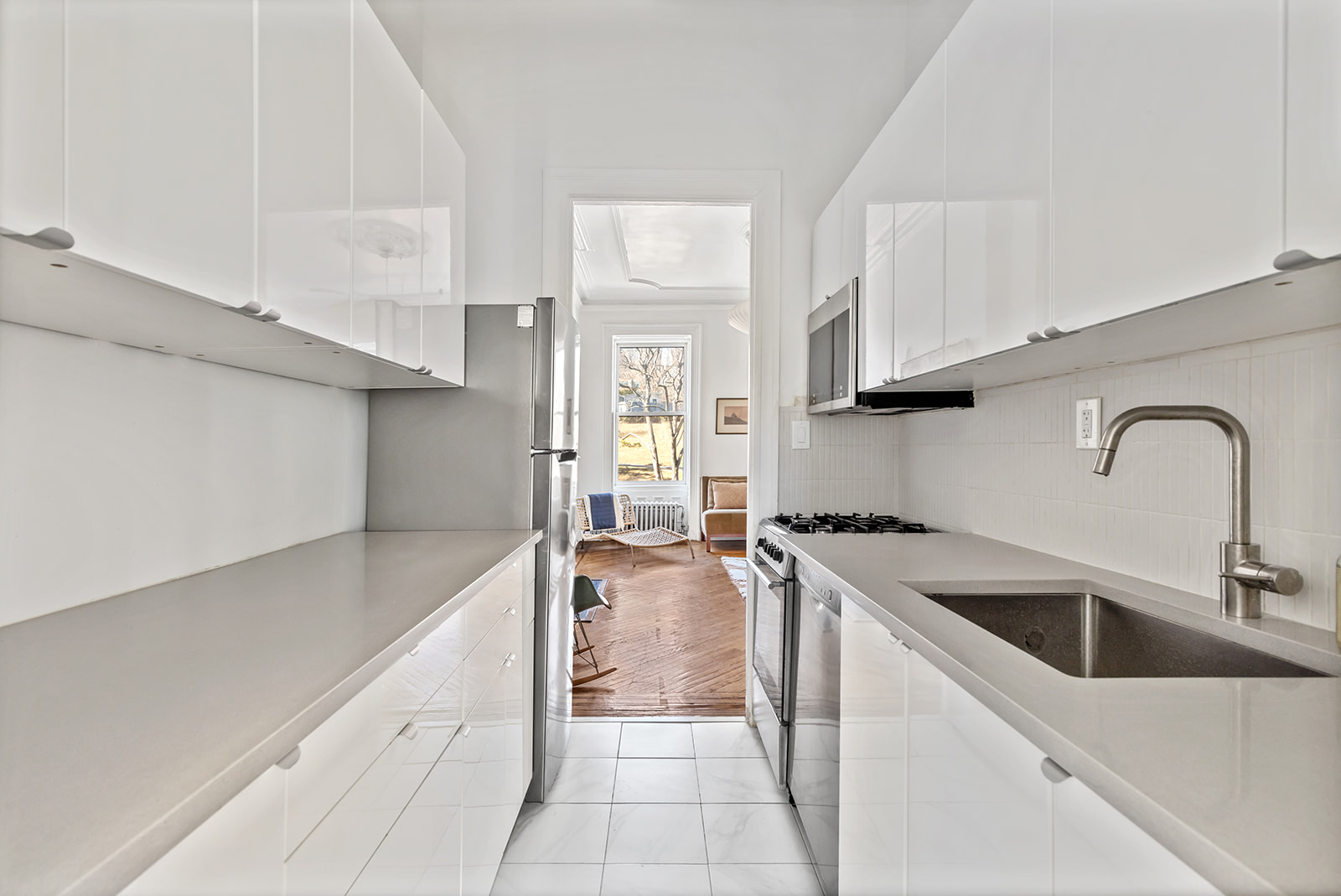 166 Washington Park, Unit 2 Brooklyn, NY 11205 - Photo 2 of 9 a kitchen with stainless steel appliances granite countertop a sink stove and cabinets