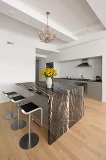 a kitchen with a table and chairs