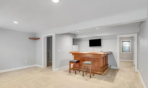 a room with furniture and flat screen tv