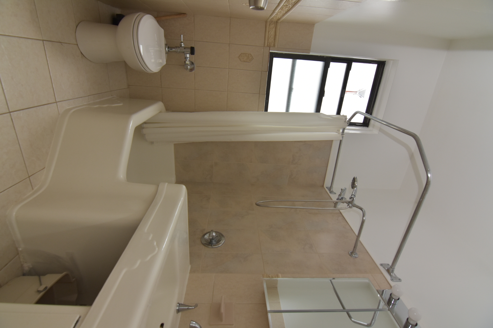 668 Riverside Drive, Unit 5A Manhattan, NY 10031 - Photo 5 of 8 a bathroom with a sink a toilet and shower