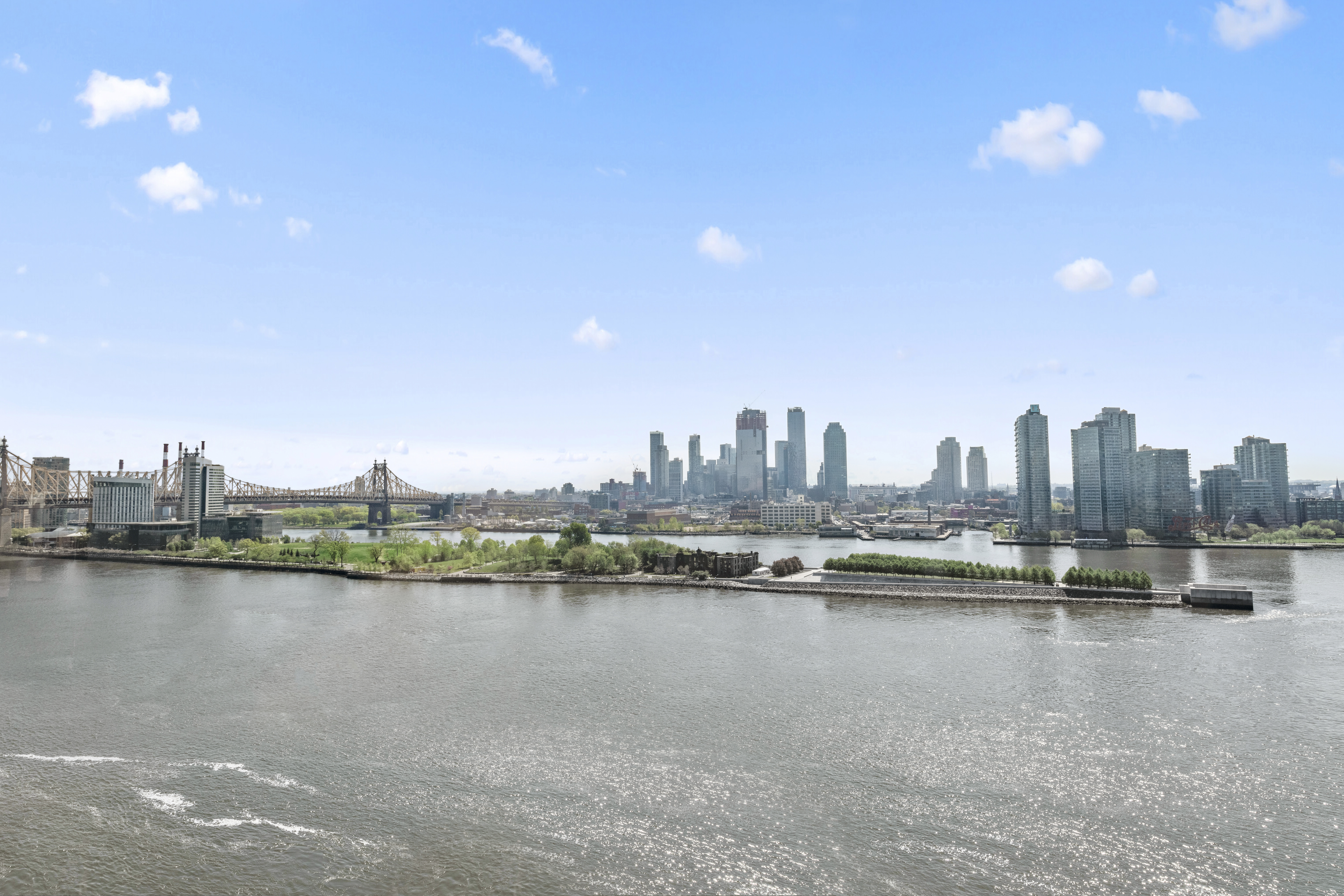 870 United Nations Plaza, Unit 15E Manhattan, NY 10017 - Photo 16 of 19 a view of a city with lake