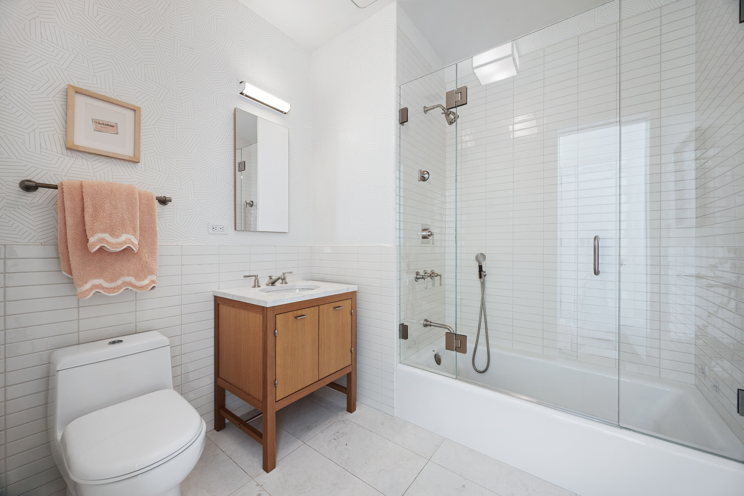 71 Laight Street, Unit 2F Manhattan, NY 10013 - Photo 11 of 20 a bathroom with a sink toilet and shower