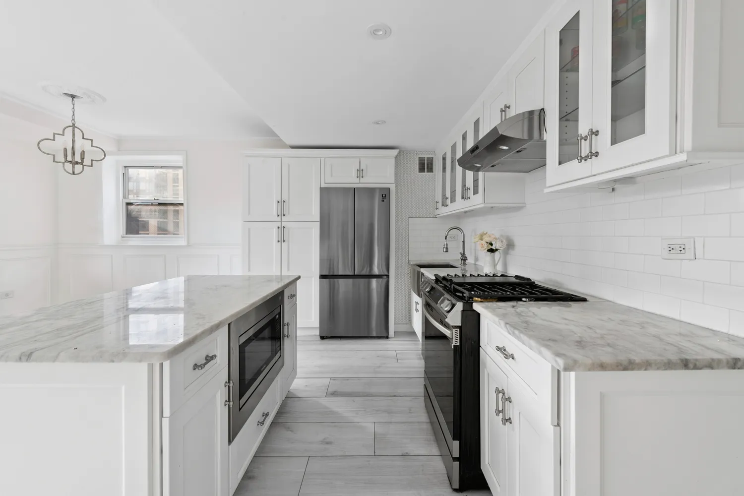 a kitchen with stainless steel appliances granite countertop a stove and a sink