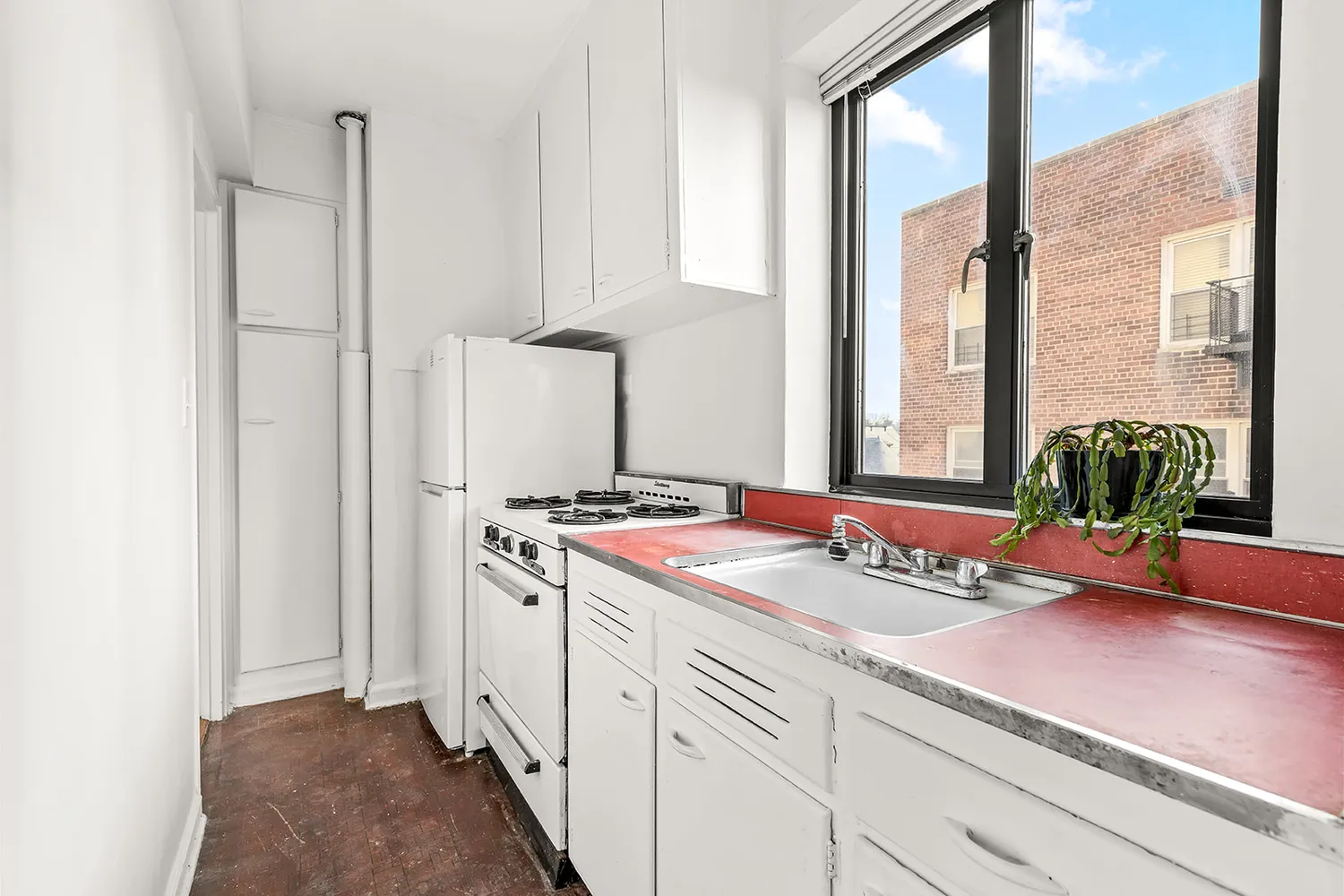 a kitchen with a sink and a stove