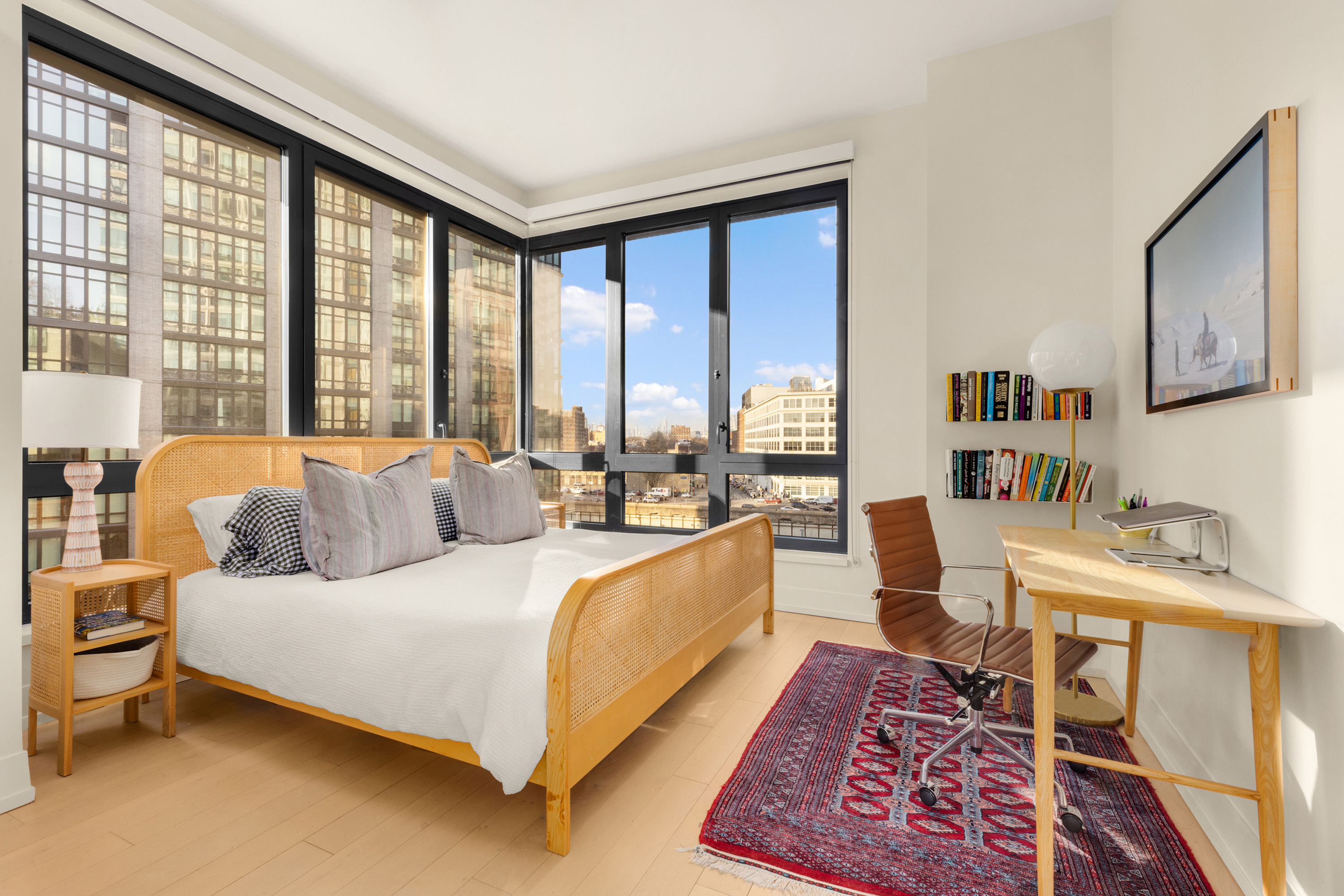 550 Vanderbilt Avenue, Unit 428 Brooklyn, NY 11238 - Photo 4 of 14 a spacious bedroom with a large bed and a couch next to a window