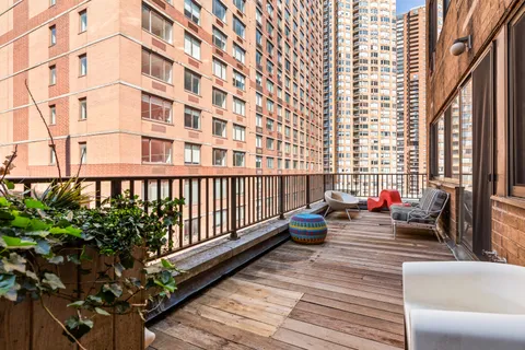 a balcony view with outdoor seating