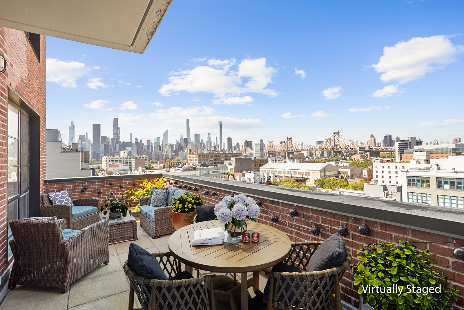 21-10 44th Drive, Unit PHA Queens, NY 11101 - Photo 3 of 18 a view of a balcony and mountain with sitting space