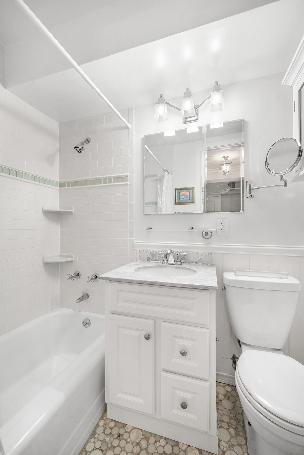 311 East 71st Street, Unit 2B Manhattan, NY 10021 - Photo 9 of 10 a bathroom with a sink a toilet and bathtub