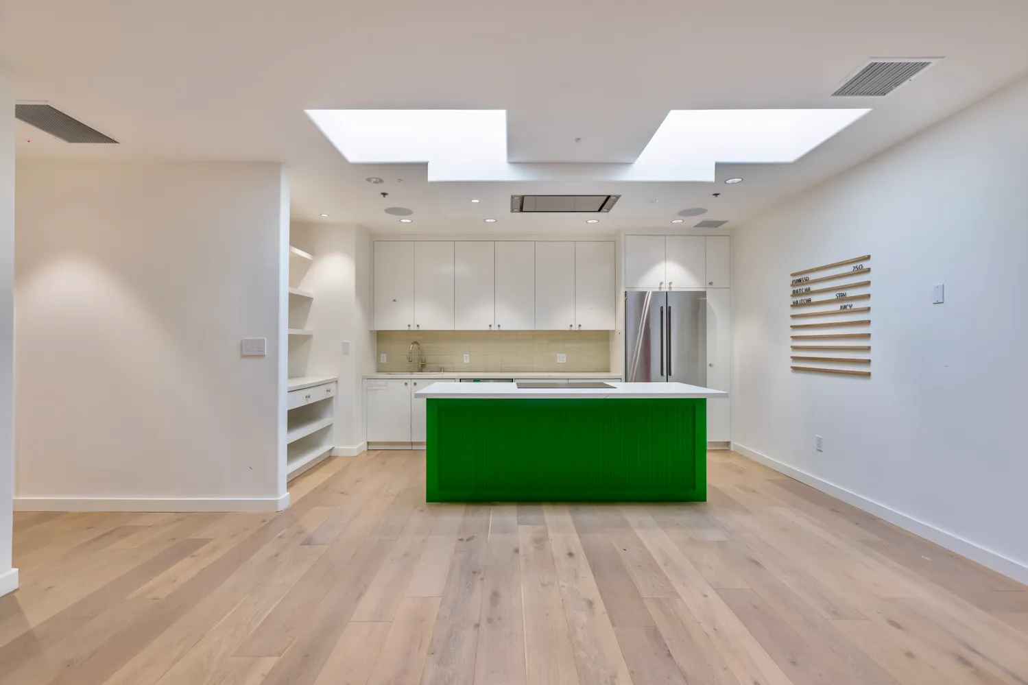 a kitchen with a refrigerator and a sink