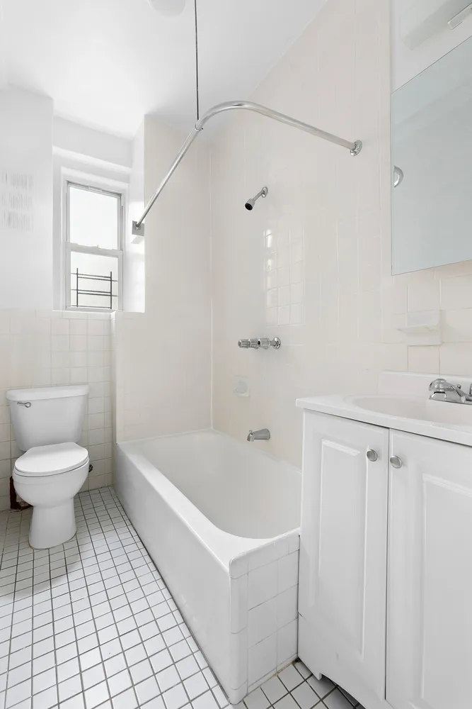 a bathroom with a sink a toilet and a bathtub