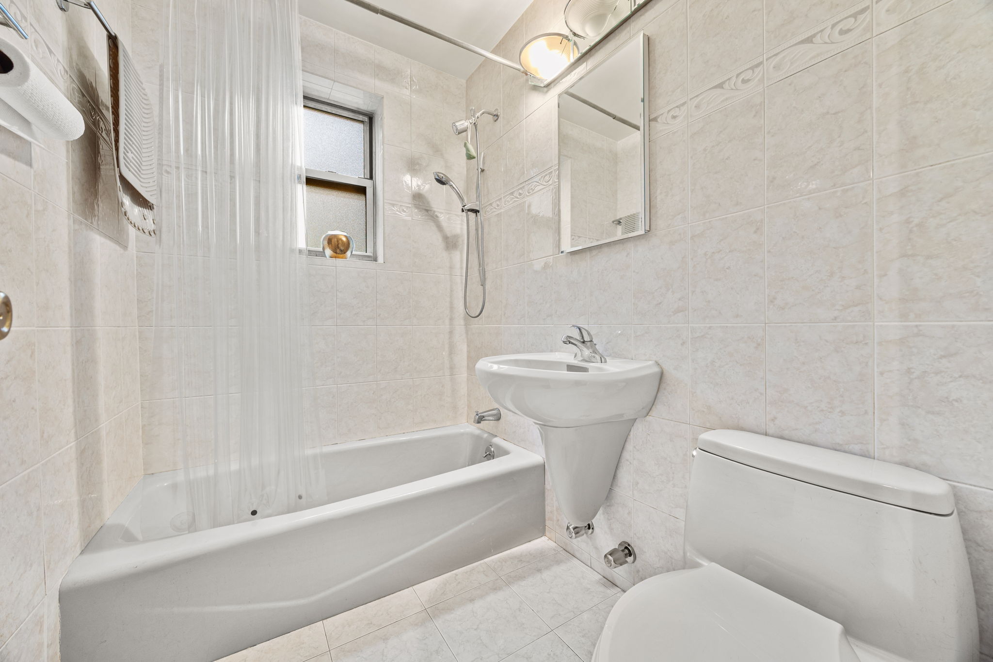 3850 Hudson Manor Terrace, Unit 1EE/2EE Bronx, NY 10463 - Photo 9 of 27 a bathroom with a sink toilet and shower