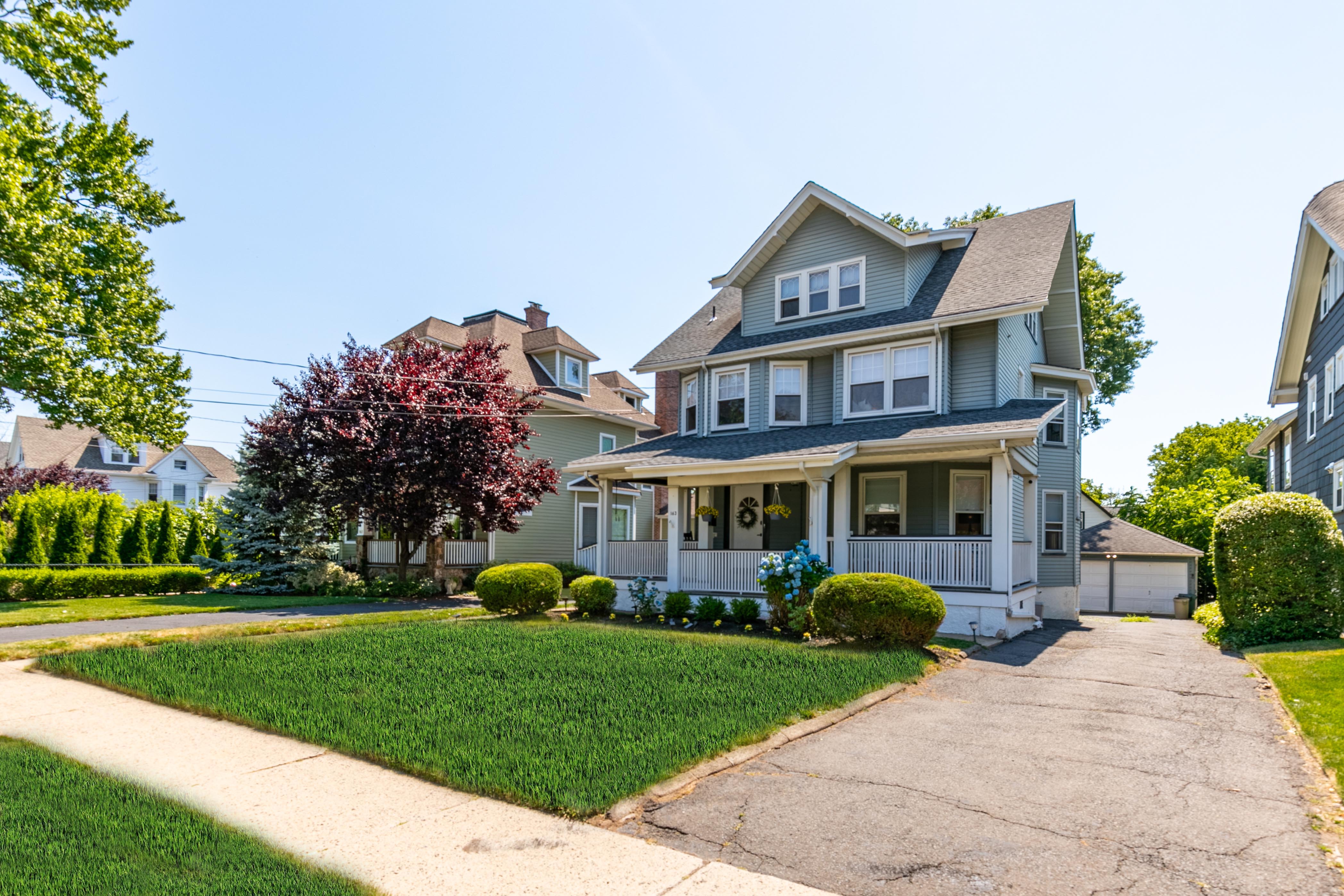 163 Ridge Road Rutherford, NJ 07070 - Photo 53 of 59 a front view of house with yard and green space