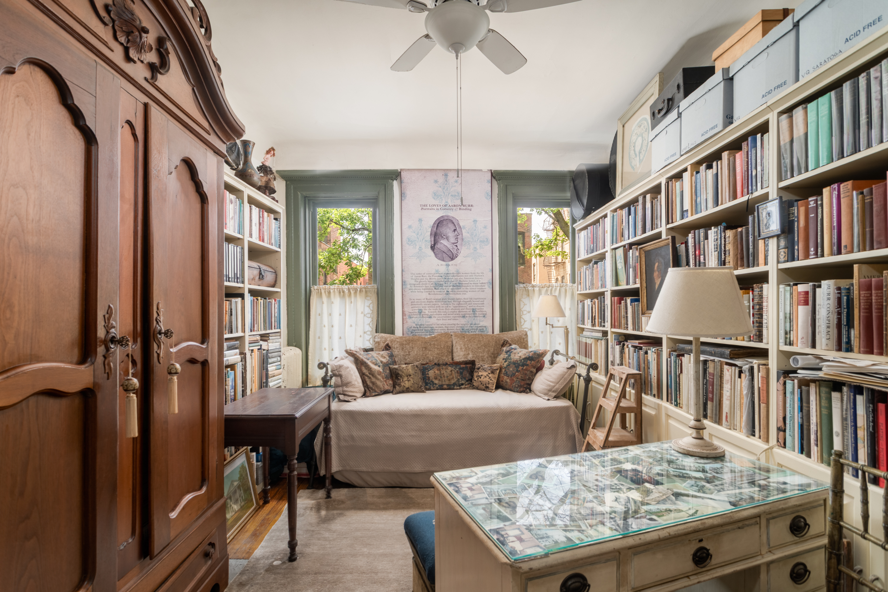 426 West 160th Street Manhattan, NY 10032 - Photo 15 of 33 a living room with fireplace furniture and a book shelf