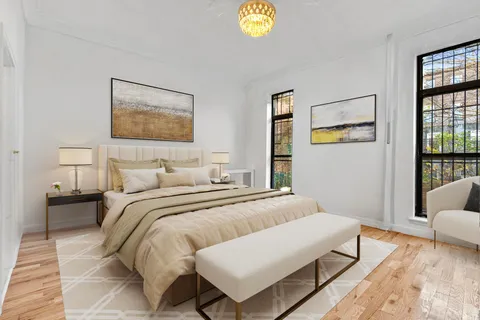 a bedroom with a bed and a lamp on table