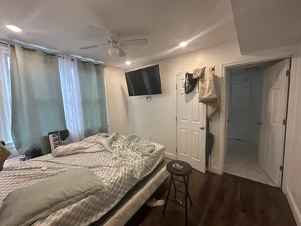 a bathroom with a sink toilet and window