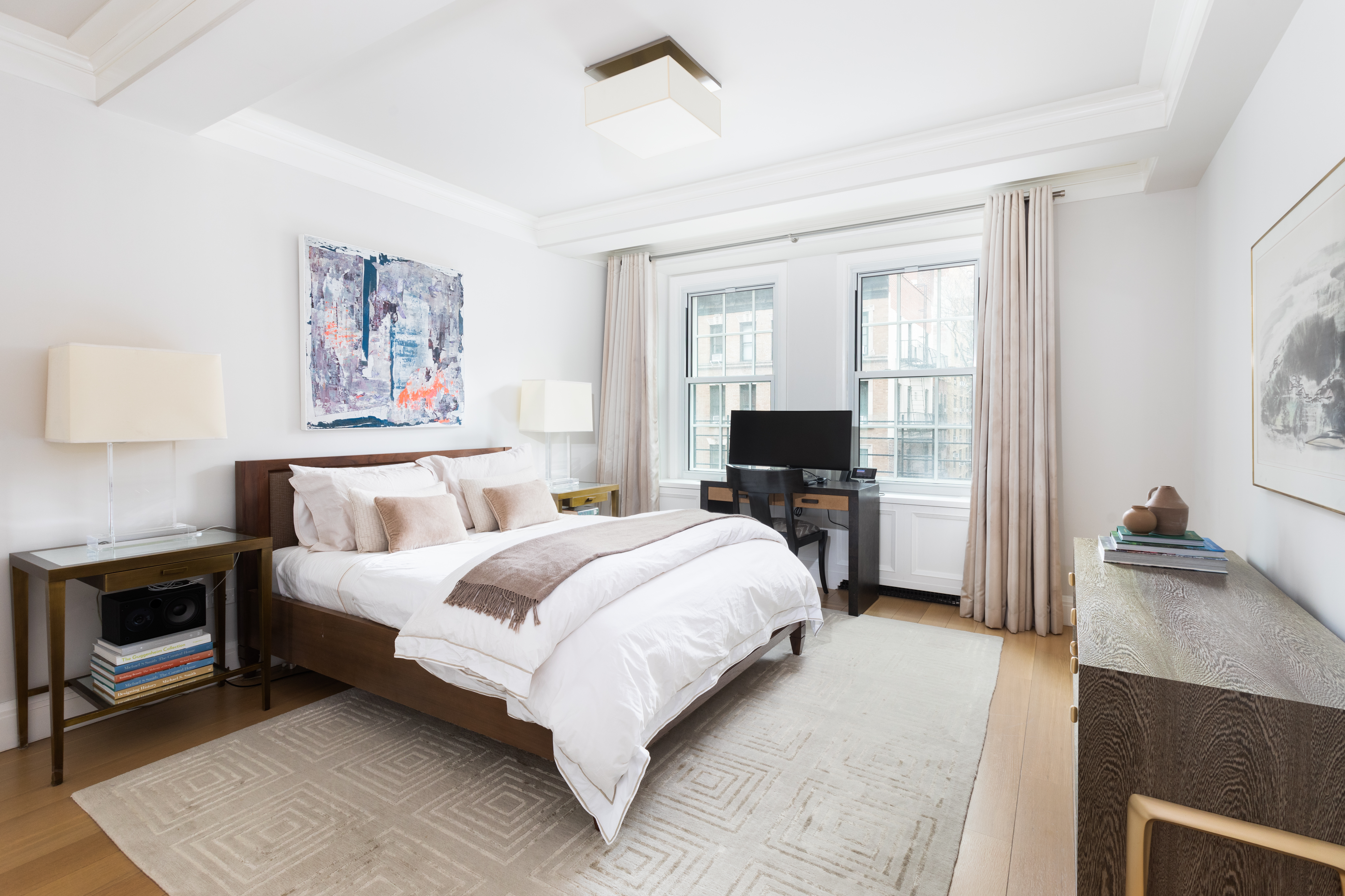 141 East 88th Street, Unit 5 Manhattan, NY 10128 - Photo 5 of 12 a spacious bedroom with a bed and a couch