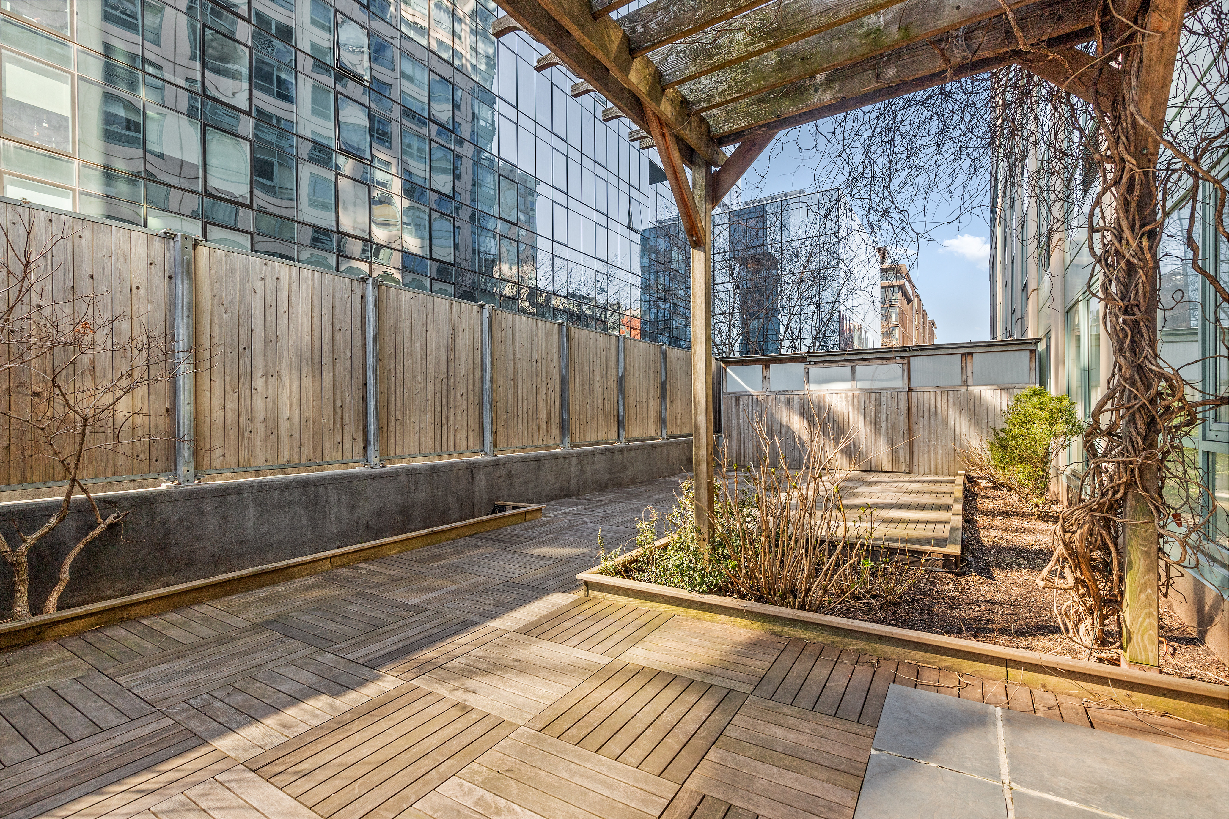 440 Kent Avenue, Unit 1B Brooklyn, NY 11249 - Photo 20 of 22 a view of a pathway along a building