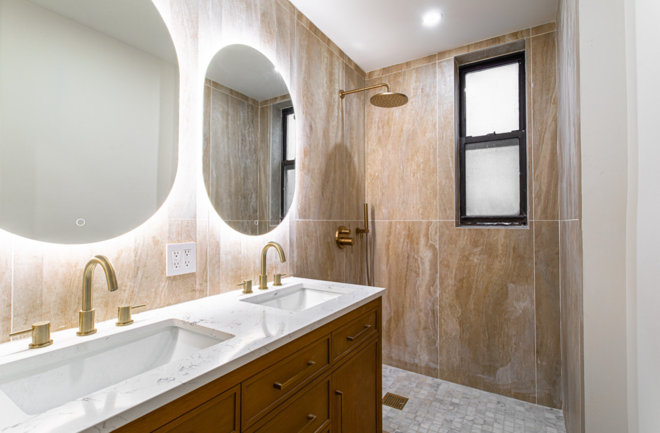 28 West 69th Street, Unit 6B Manhattan, NY 10023 - Photo 6 of 9 a bathroom with a double vanity sink and a mirror