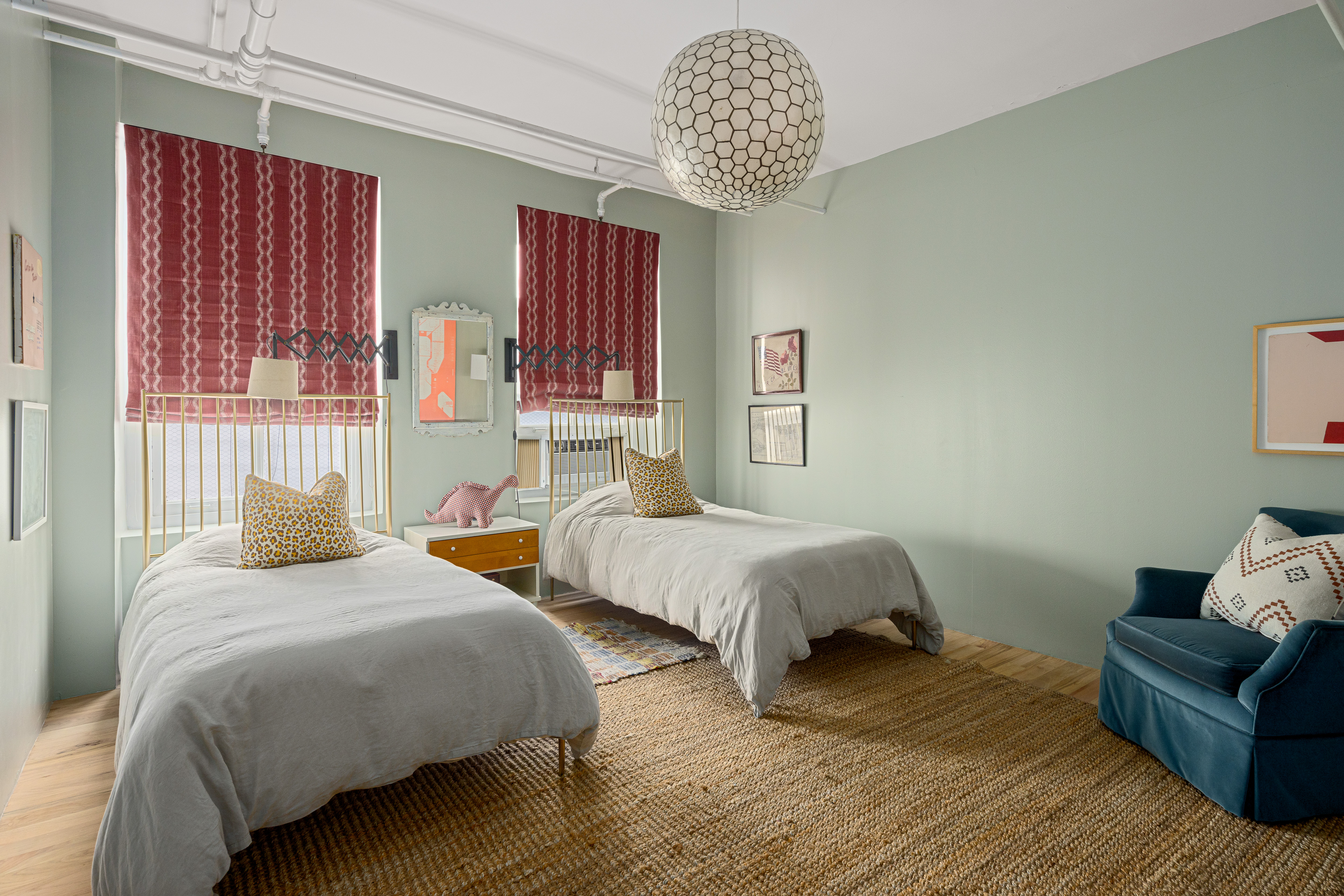 191 Chrystie Street, Unit 5R Manhattan, NY 10002 - Photo 11 of 16 a bedroom with two beds and a chandelier