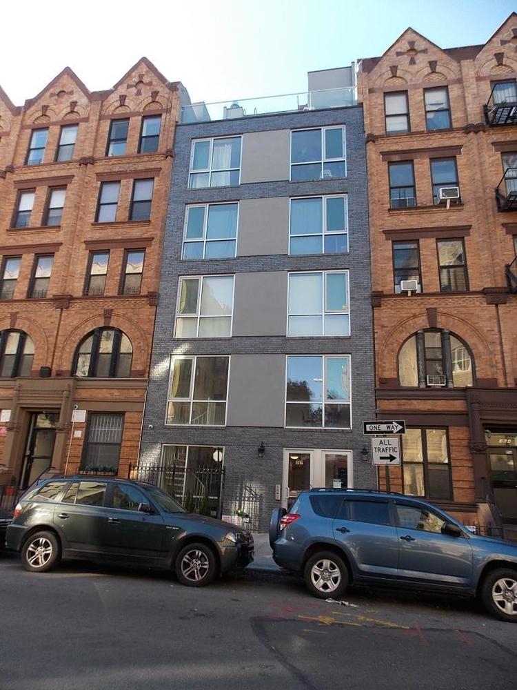 362 West 127th Street, Unit 5A Manhattan, NY 10027 - Photo 9 of 10 a car parked in front of a building