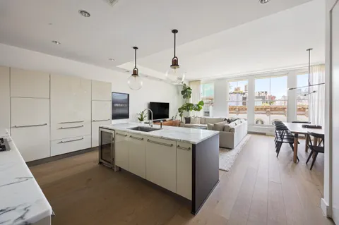 a kitchen with stove and cabinets