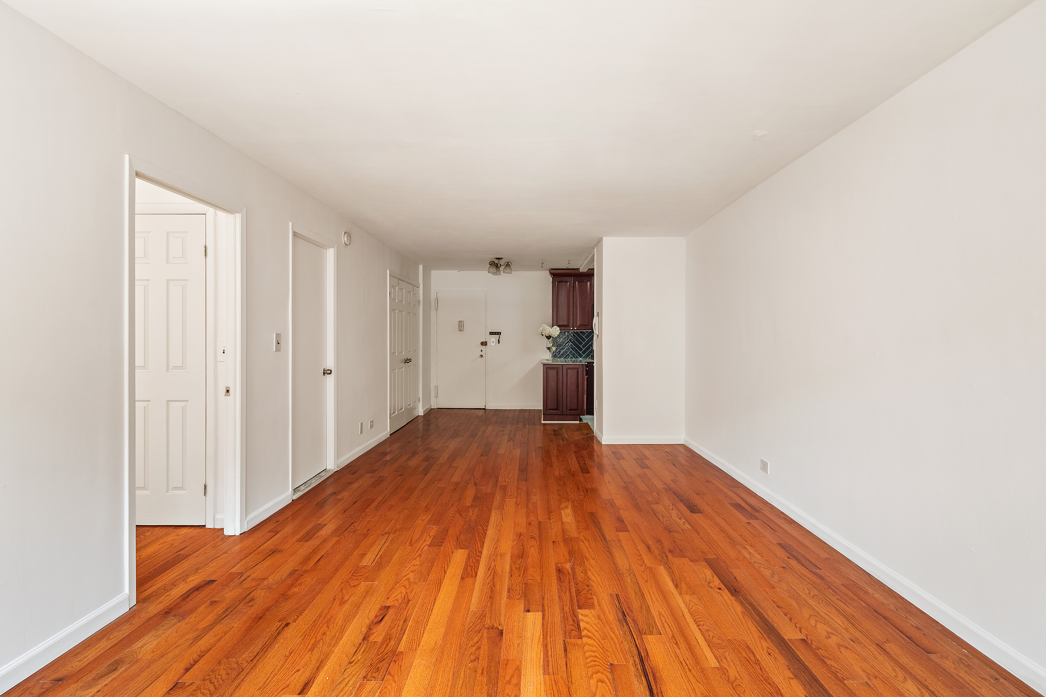 85 Livingston Street, Unit 3H Brooklyn, NY 11201 - Photo 4 of 9 a view of empty room with wooden floor