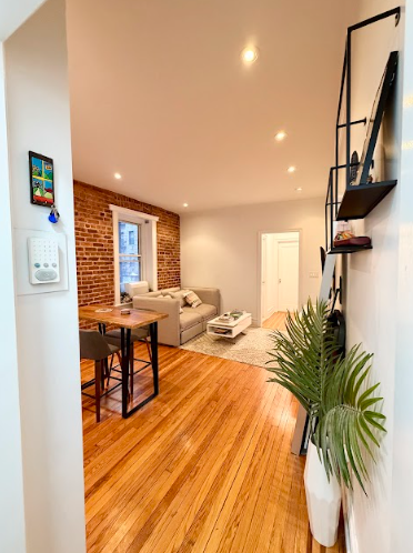 223 East 50th Street, Unit 1C Manhattan, NY 10022 - Photo 5 of 10 a view of a livingroom with furniture and a window