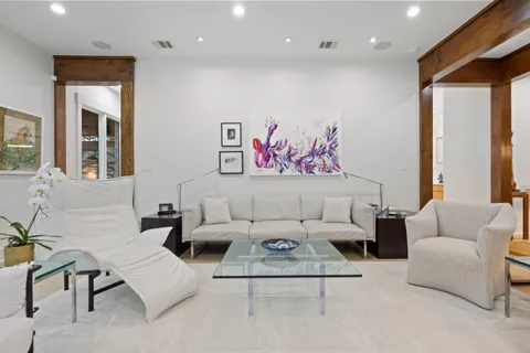 a living room with furniture and a table