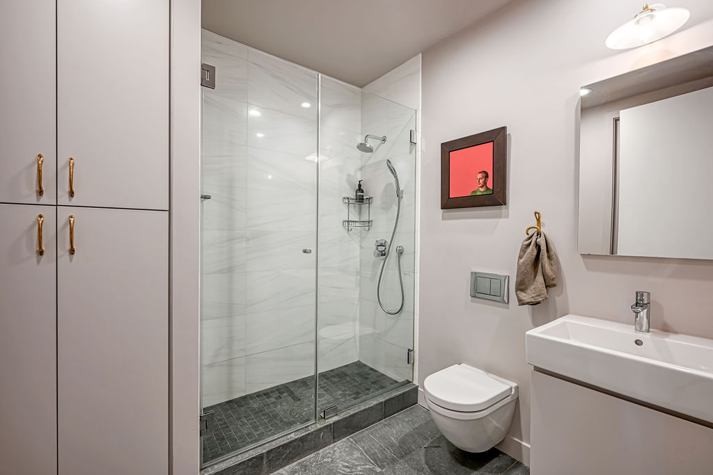 42 East 12th Street, Unit 2 Manhattan, NY 10003 - Photo 12 of 18 a bathroom with a toilet sink and shower