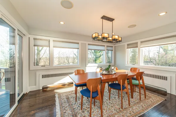 a view of a dining room with furniture window and outside view