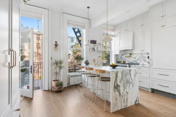 a kitchen with stainless steel appliances sink stove and refrigerator