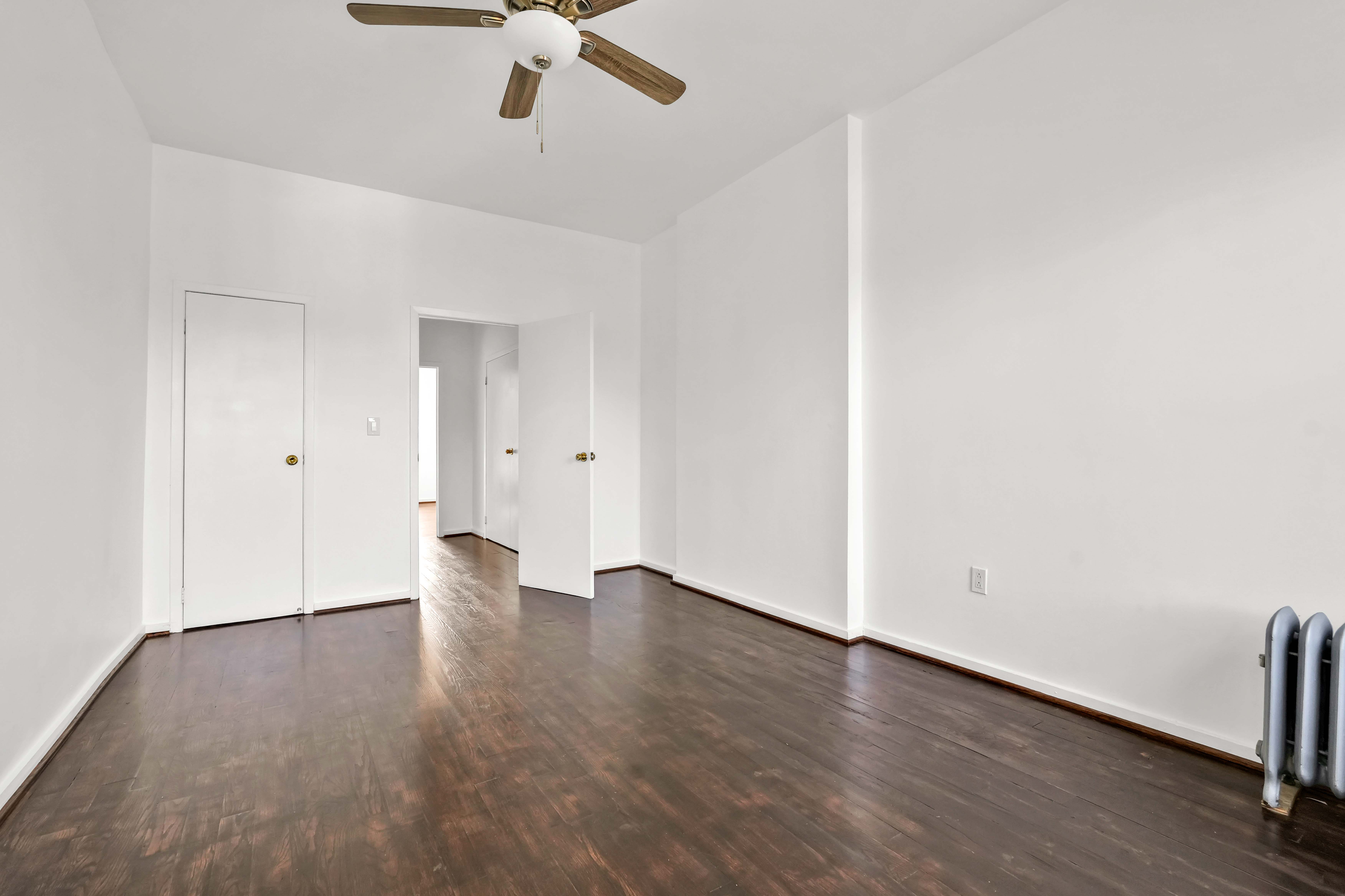 238 Vernon Avenue, Unit 3 Brooklyn, NY 11206 - Photo 3 of 19 wooden floor in an empty room