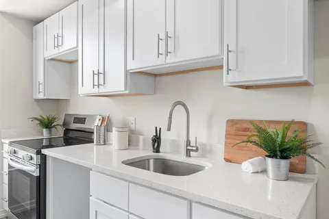 a bedroom with furniture and a large window