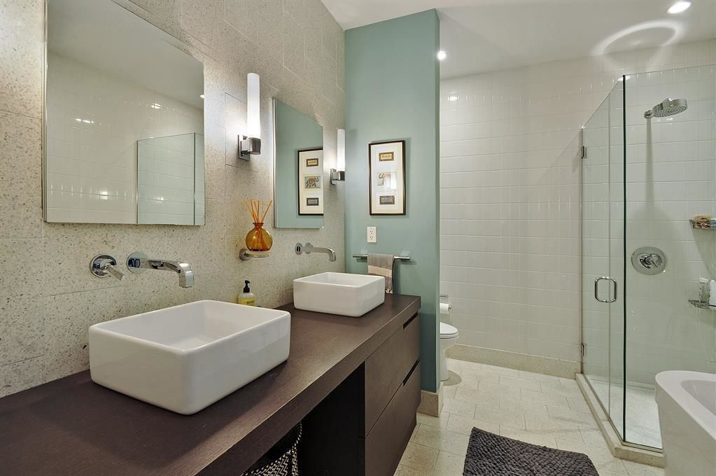 360 Furman Street, Unit 511 Brooklyn, NY 11201 - Photo 7 of 37 a bathroom with a sink and mirror