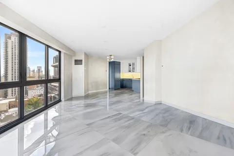 a view of an empty room and a window