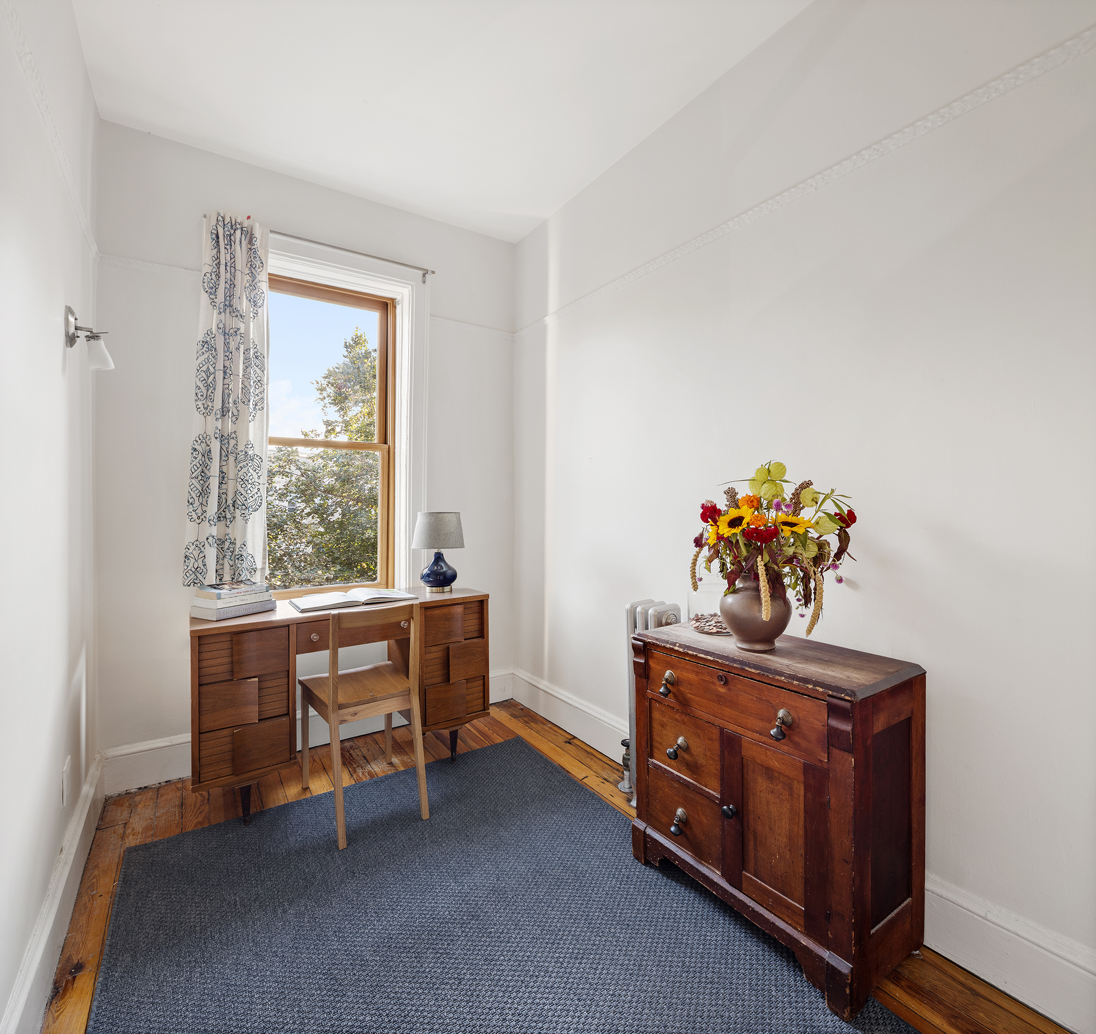 195 Lefferts Avenue Brooklyn, NY 11225 - Photo 12 of 18 a room with furniture and a window